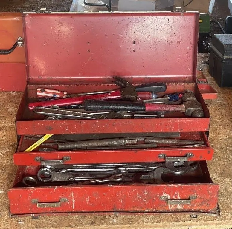 Three-drawer toolbox with wrenches, hammers,