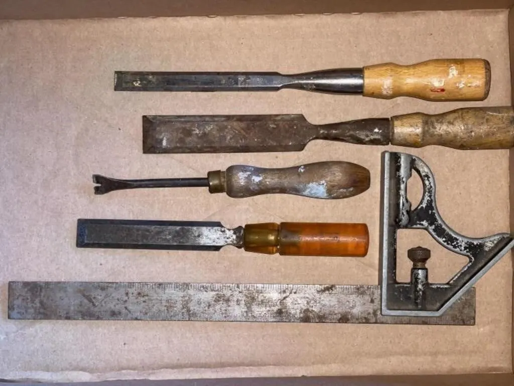 Wood chisels and a combination square.