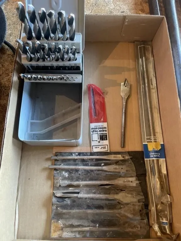 Assorted metal and wood drill bits. Comes with a