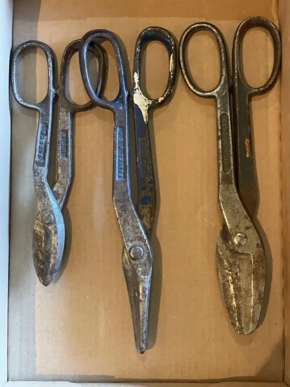 Three pairs of tin snips.