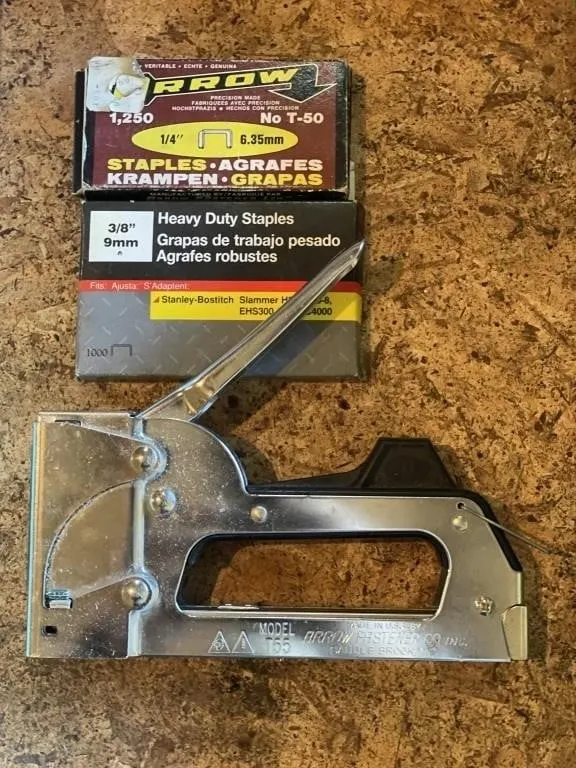 Manual stapler and packs of staples. .