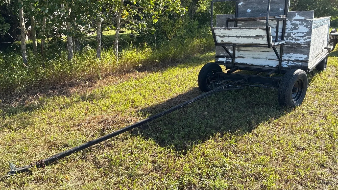 Horse drawn wagon with benches for giving rides
