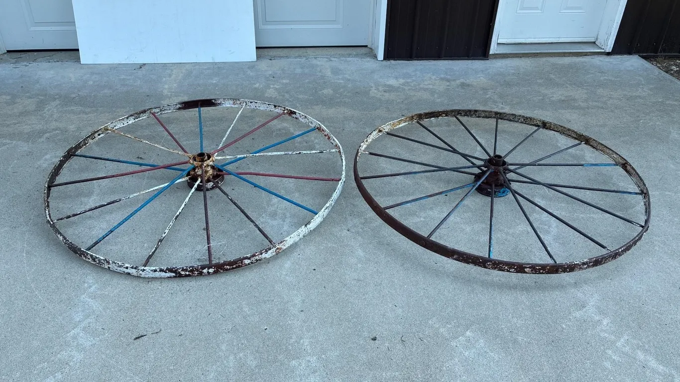 Two 53.5” steel implement wheels. Round spokes.