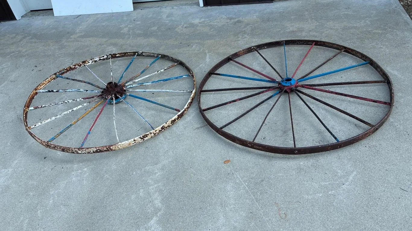 Two 53.5” steel implement wheels. Flat spokes. .