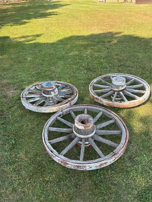 Three 36” wooden wagon wheels. Loose. Need wire