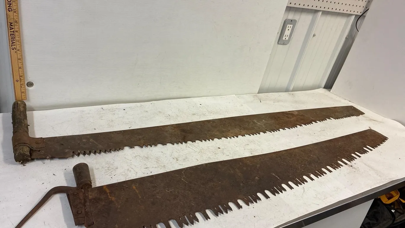 48” ice saw and 54” two man saw. Missing handles