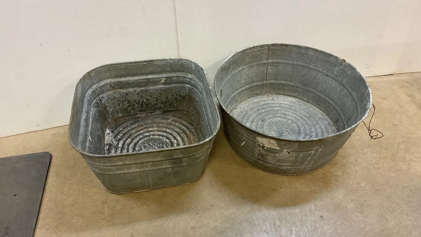 2 galvanized wash tubs. Missing handles.