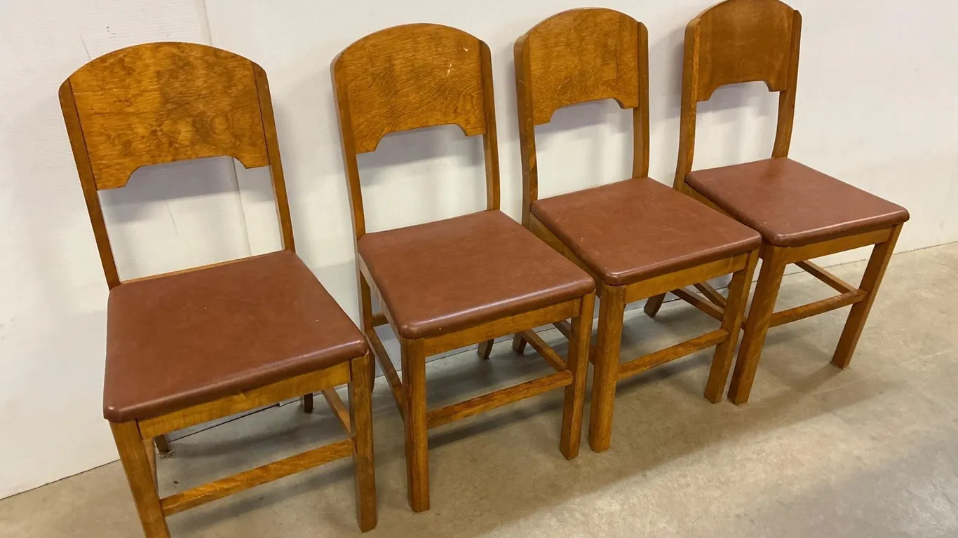 Set of 4 retro chairs. Brown leather seat.