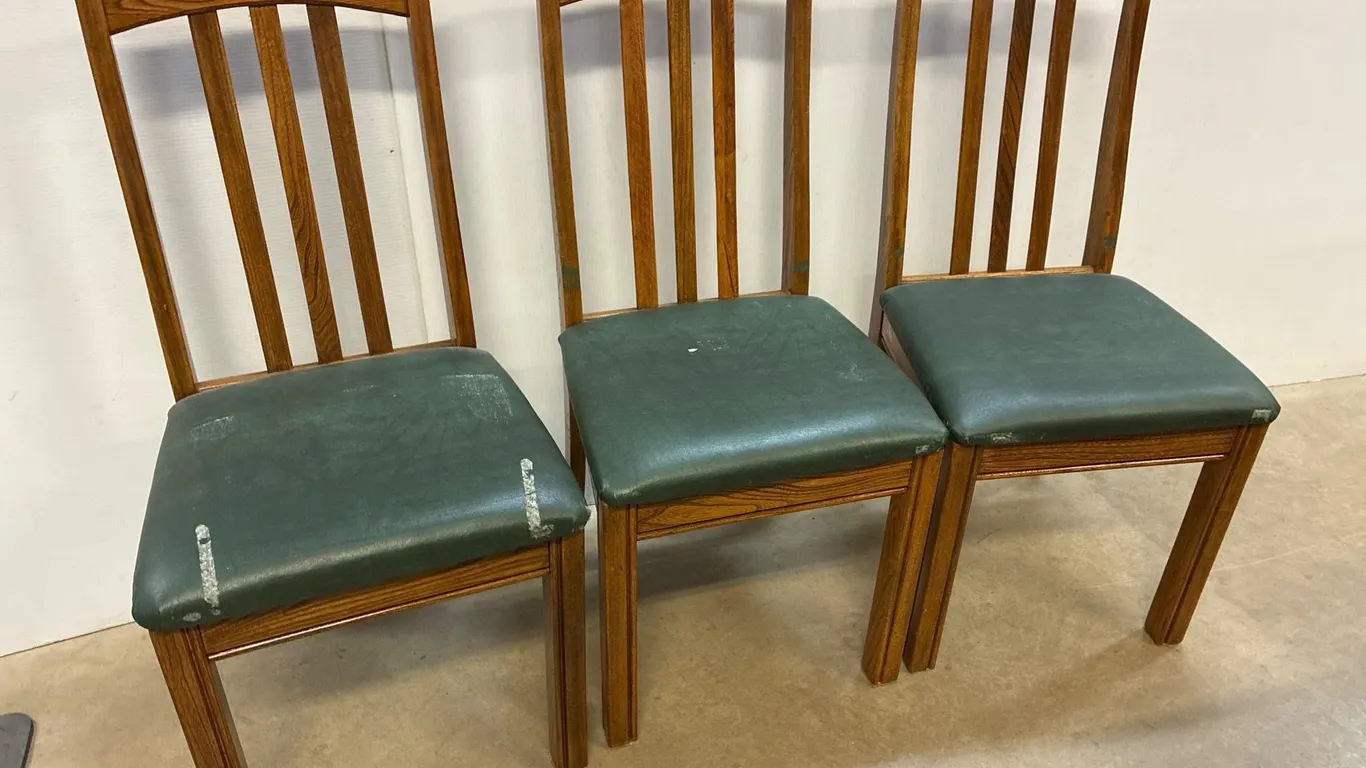 3 matching chairs. Green padded seats.