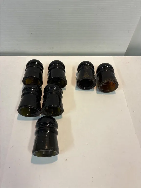Green/yellow. Green/brown glass insulators