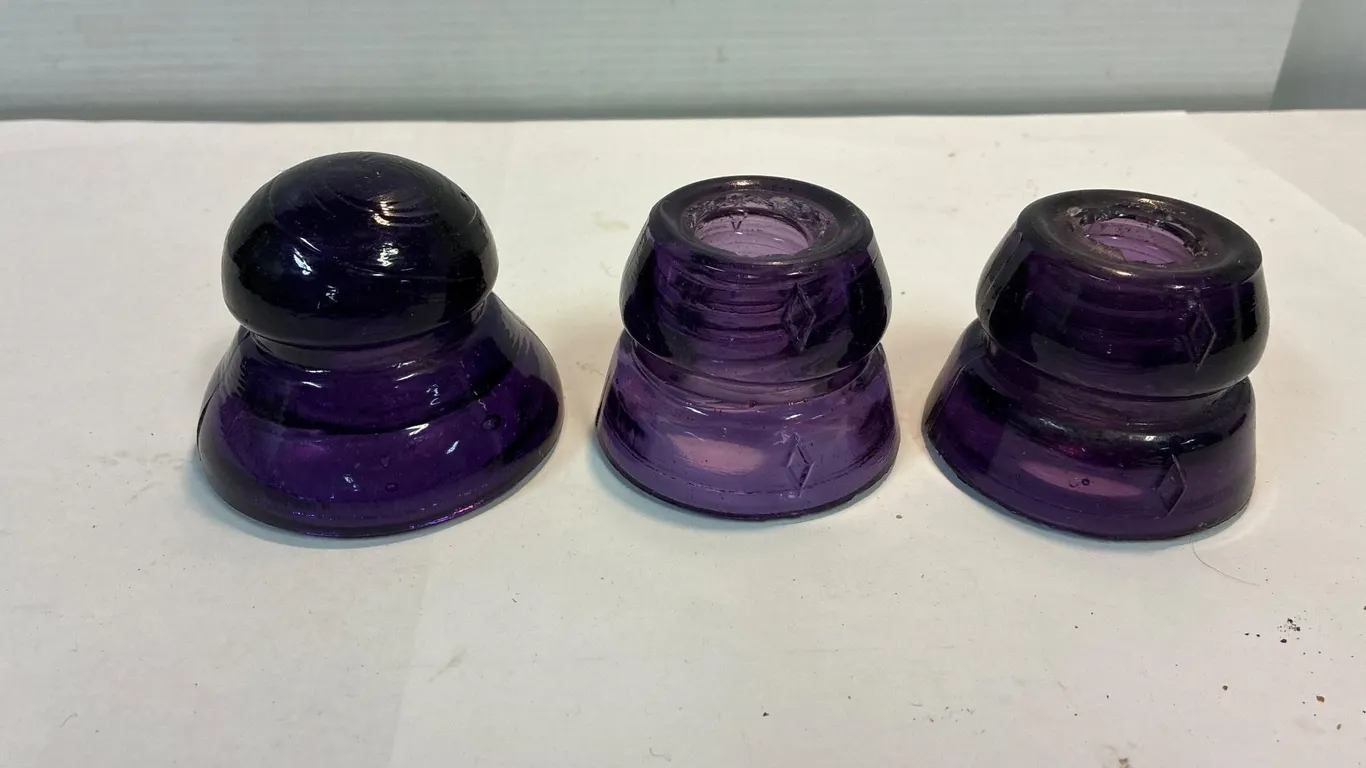 Purple glass insulators