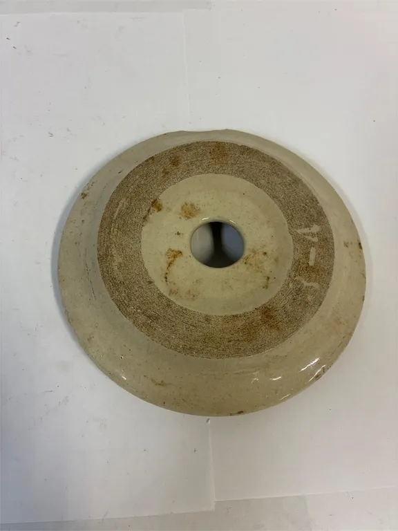 Butter churn stoneware lid.