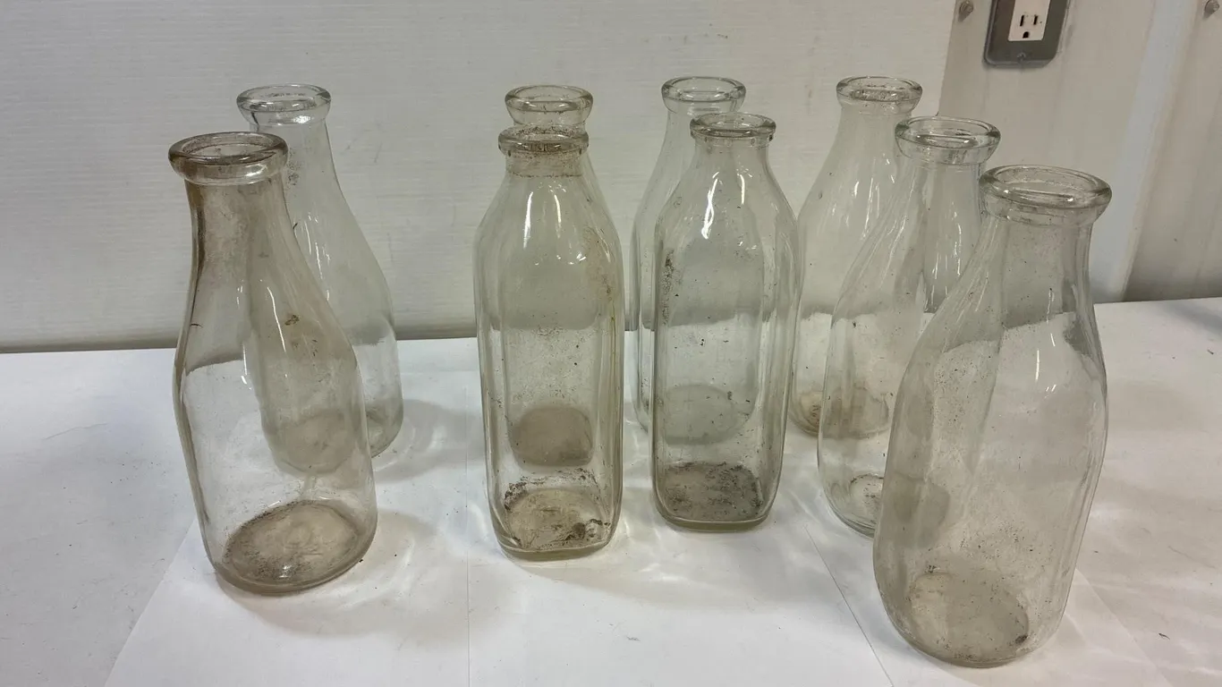 9 glass milk bottles 2 round. 7 square