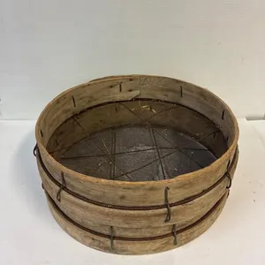 Antique bentwood grain sieves.
