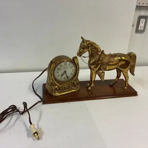 Brass western horse clock.  Needs a new cord