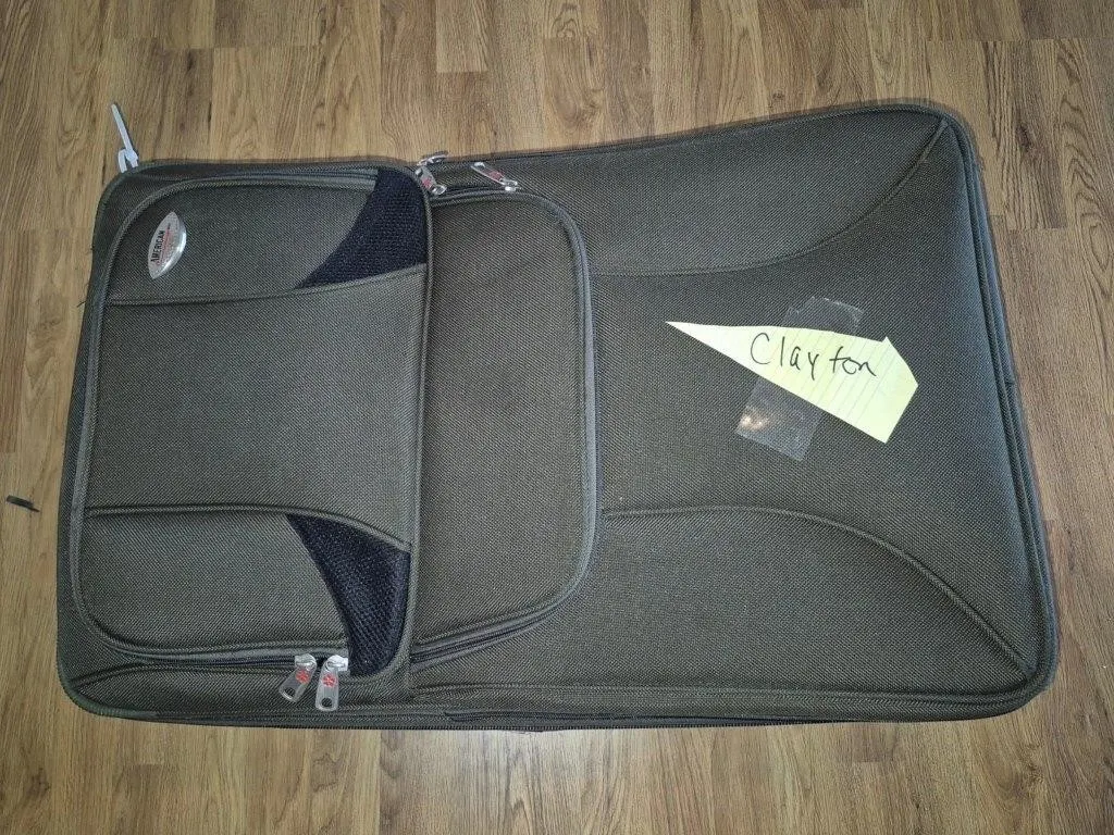 American Tourister Rolling Suit Case