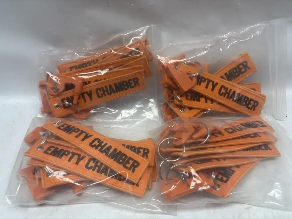 'Empty Chamber' Firearm Flag Keychains, Lot of ~28
