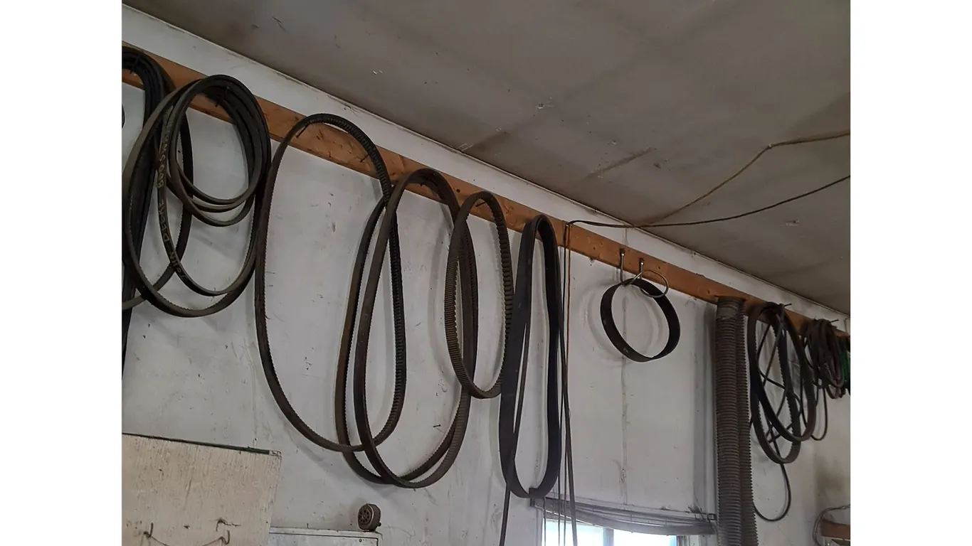 Large Hanging Assortment of Farm Implement Belts