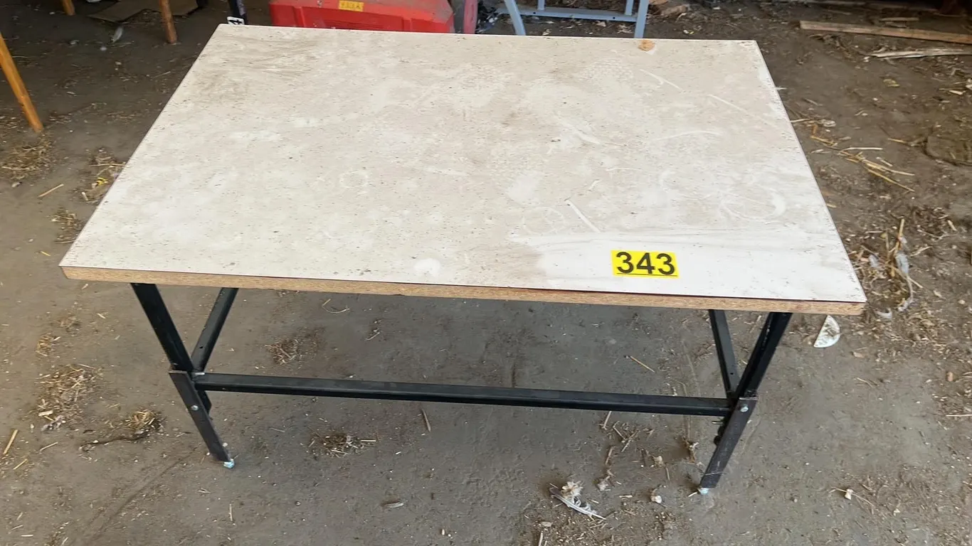 OFFSITE - Metal desk with wood top. 28”x43”x25” tall.