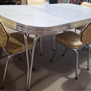 Antique table with 4 chairs. Has 2 leafs. 70" L x 36" W