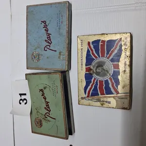 3-Cigar cases one with a cigar in it