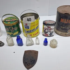 Miscellaneous tin and glass bottles