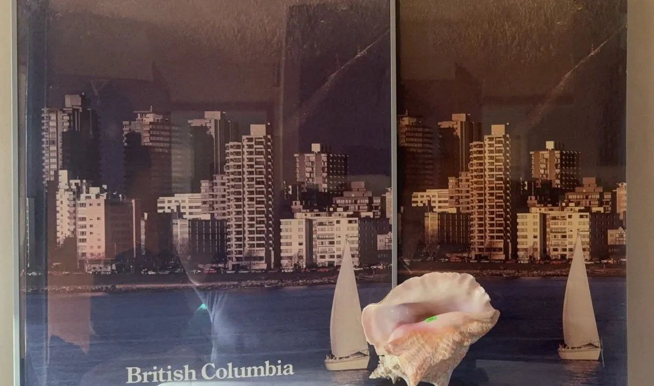 Framed Vancouver and British Columbia Posters with Conch Shell on Wooden Stand