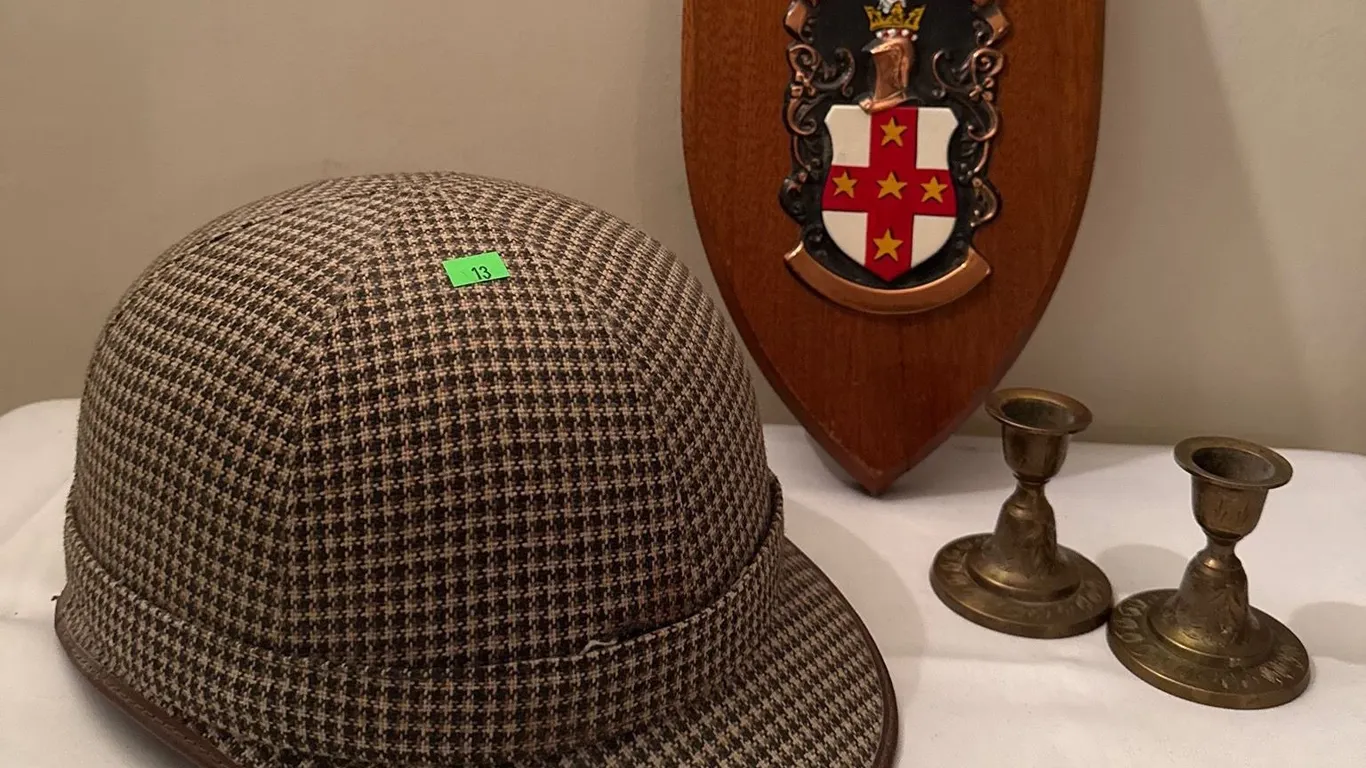 Plaid Equestrian Helmet, Adams Family Crest Plaque, and Brass Candle Holders