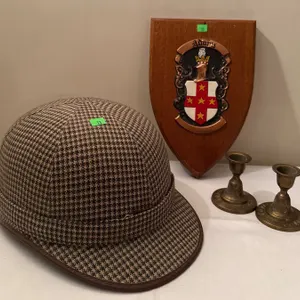 Plaid Equestrian Helmet, Adams Family Crest Plaque, and Brass Candle Holders