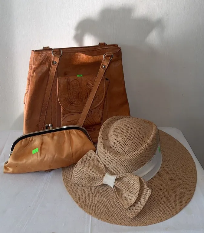 Accessories Including Tooled Leather Purse, Straw Hat With Bow, Satin Clutch, and Costume Jewellery
