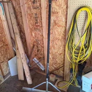 Shed Contents Including Rake, Garden Tools, Hand Tools, and Accessories