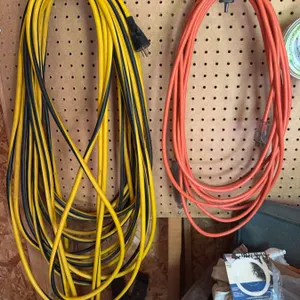 Two Heavy Duty Extension Cords – Yellow/Black and Orange