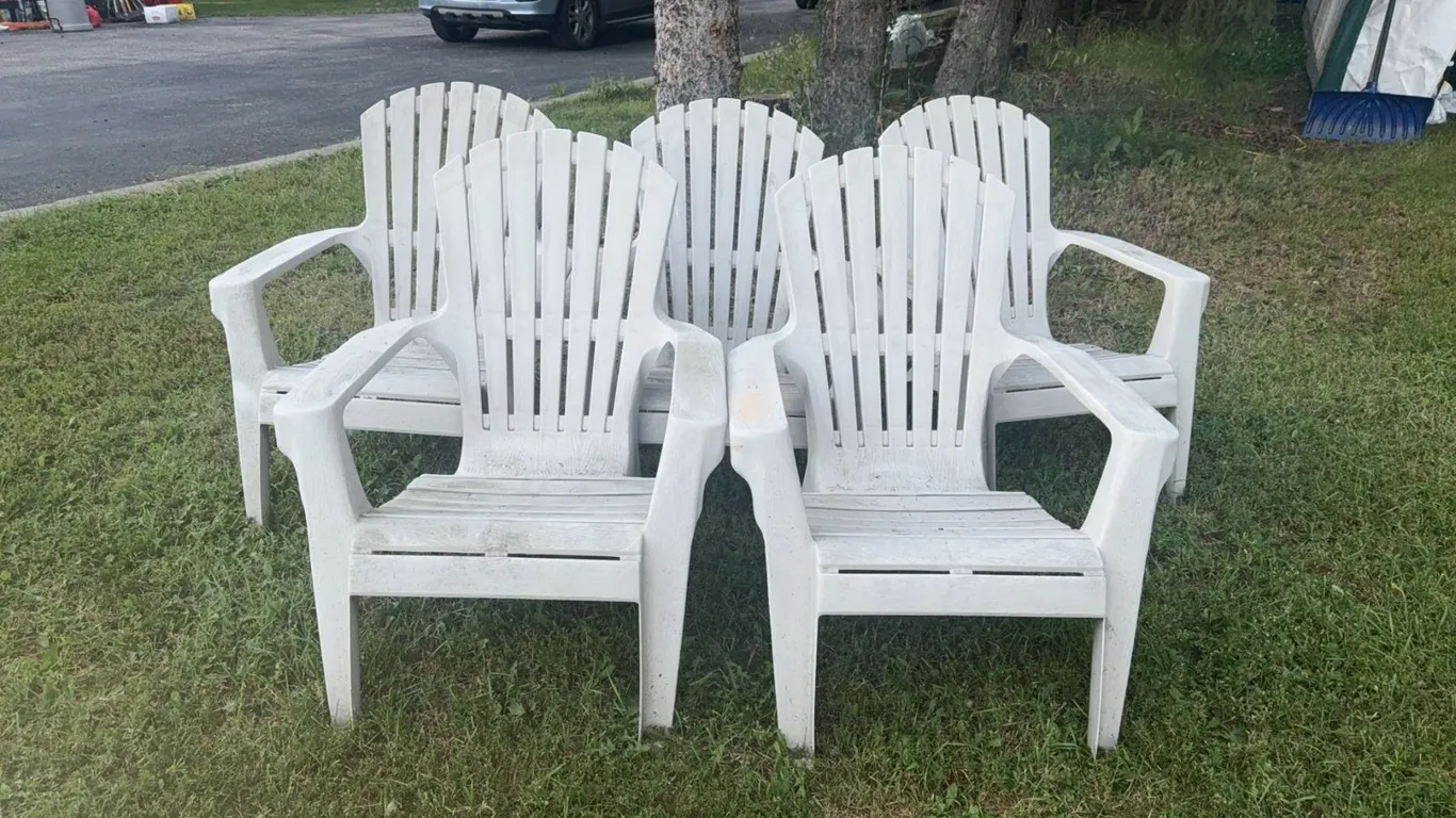 Six White Plastic Adirondack-Style Outdoor Chairs