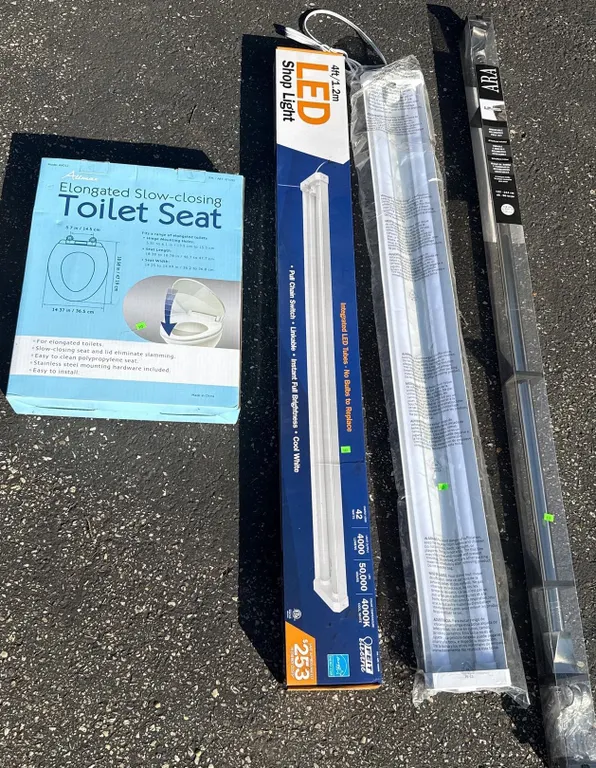 Lot Including Altura Elongated Toilet Seat, 4 ft LED Shop Light, and Delta ARA Towel Bar