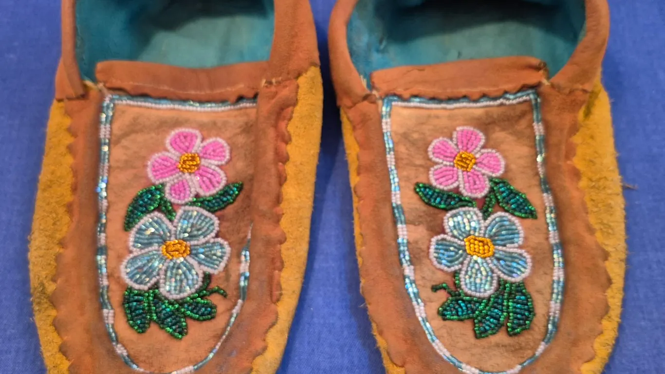 Pair of vintage hand-stitched moose hide mocassins (except for pad on sole), early facetted beadwork