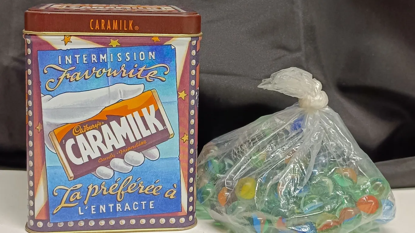 Caramilk Tin & Bag of Marbles Inside