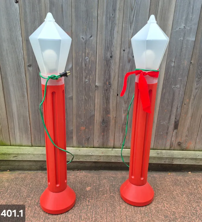 Pair of blow mold light-up outdoor candles. Approx. 39 inches tall, excellent condition