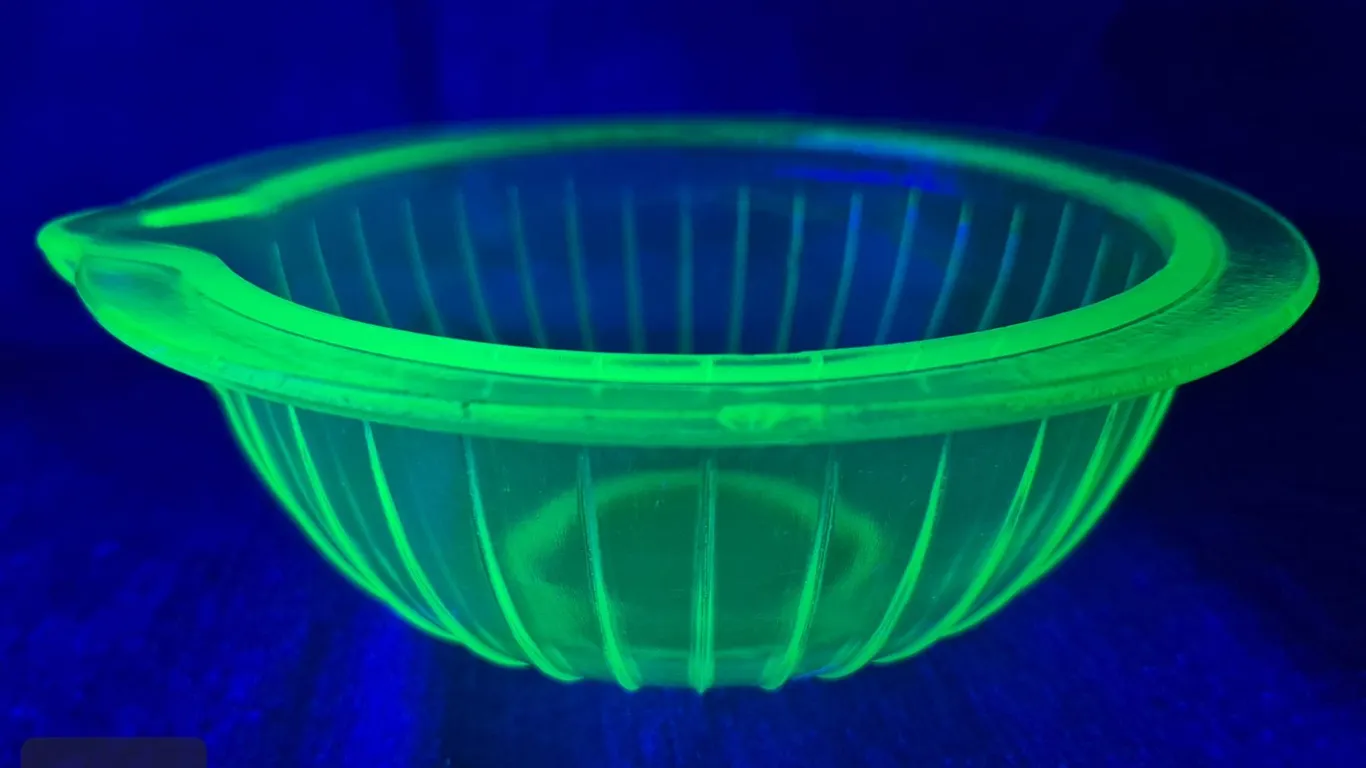 Uranium glass round ribbed and spouted bowl, 7 1/2 inches across, few nics on edge, glows!