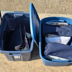 (2) Storage Totes w/ Ski Boots, Pillowcases, etc.