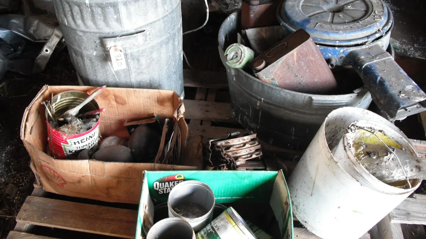 pallet of tins, block & tackle, garbage can, etc.