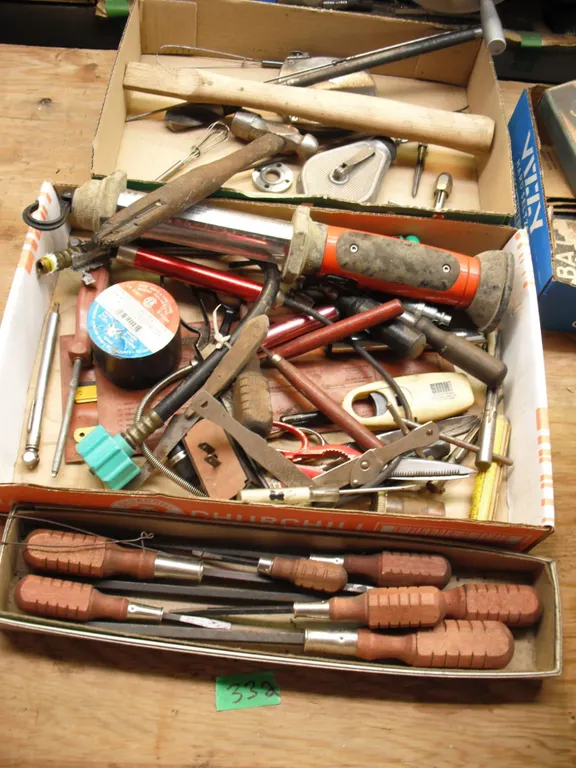 lot of tools - screwdrivers, light, measuring tape, etc.