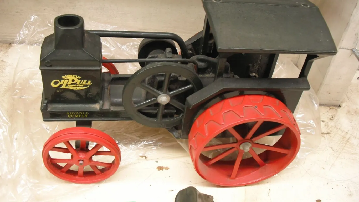 cast Rumley oil pull tractor toy - seat broken, 10" long