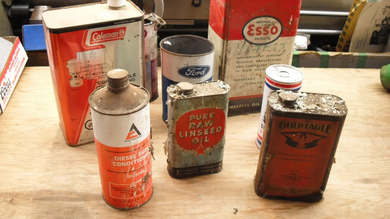 vintage oil cans - Allis-Chalmers, Esso, Gold Eagle, Ford, etc. - coleman camp fluid almost full