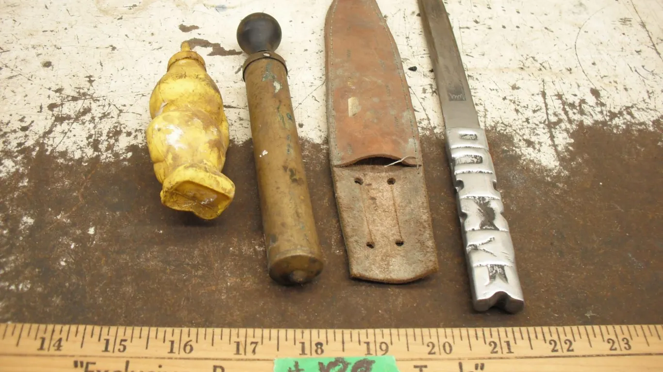 Esso figural handy oiler, metal handled knife with leather sheath & oil lamp pump