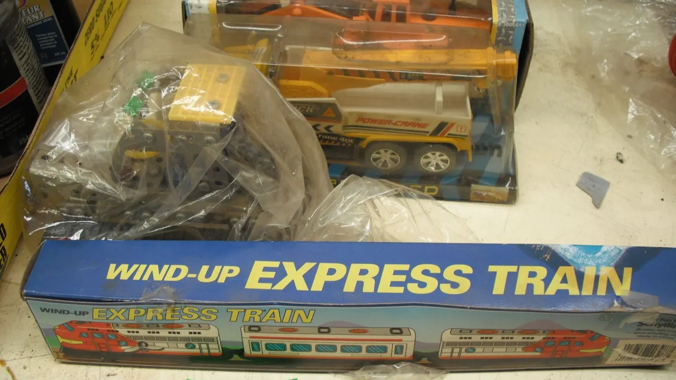 mecanno dozer, wind-up train, toy truck and digger in box