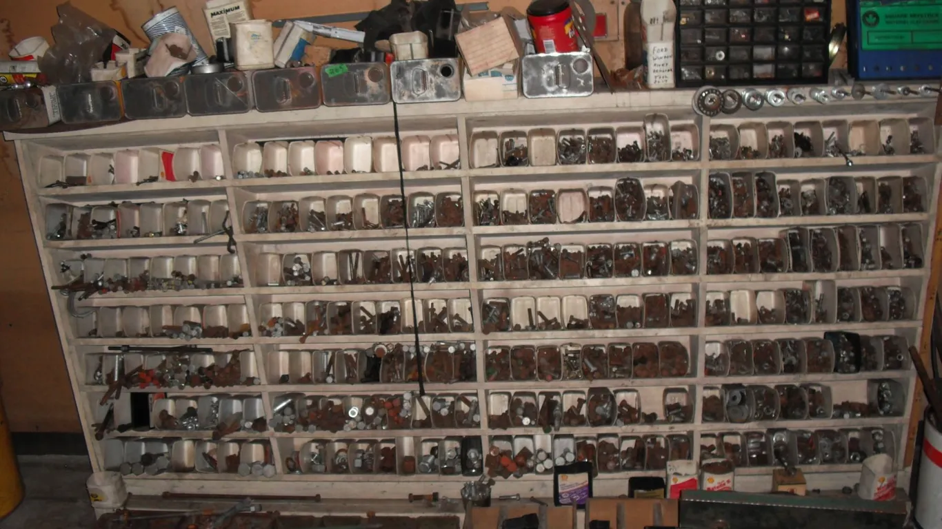 large shelf organizer w/ contents - bolts, nuts, tool box w/ tools, etc. - buyer responsible for rem
