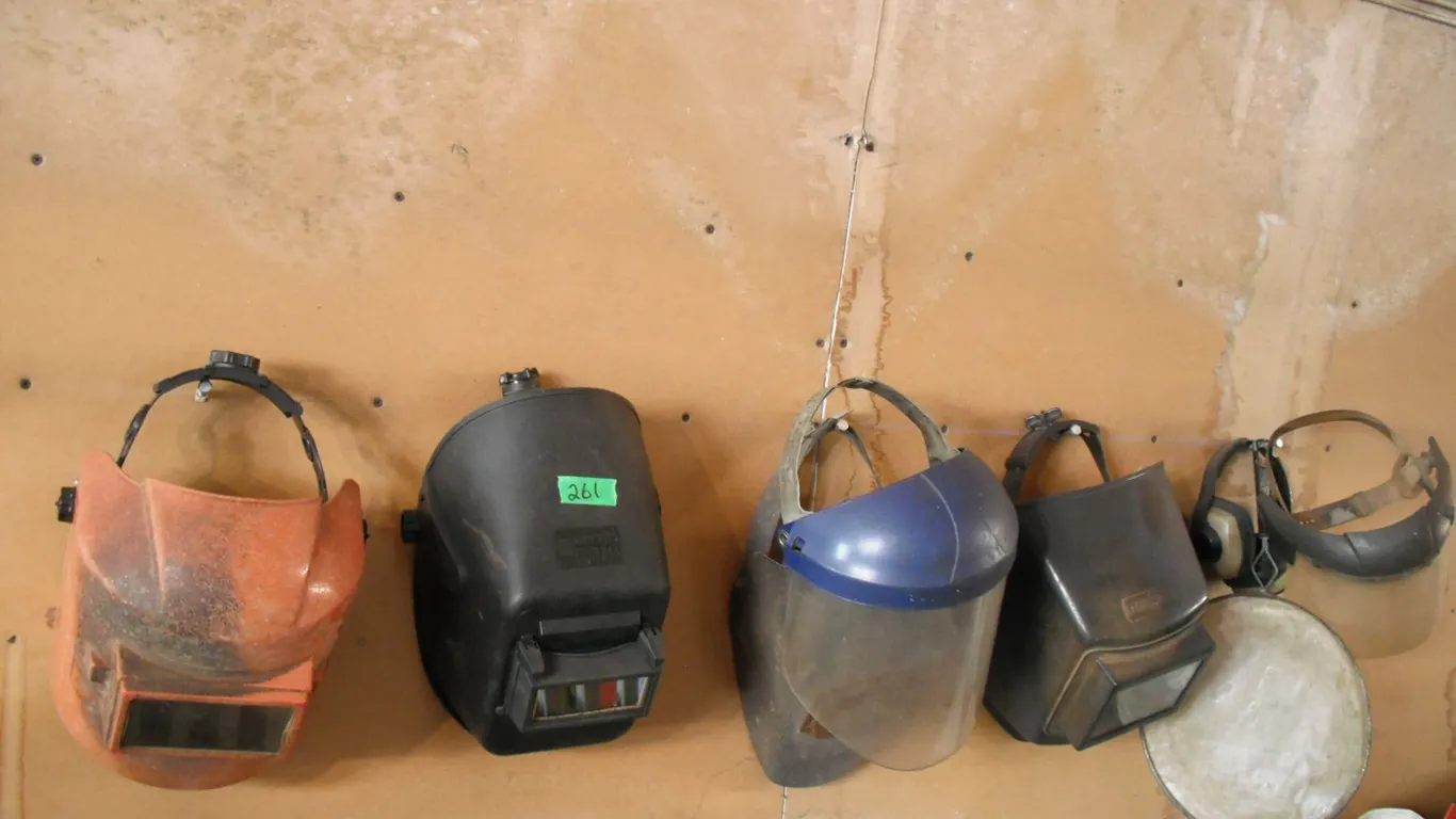 lot of welding masks and face shields