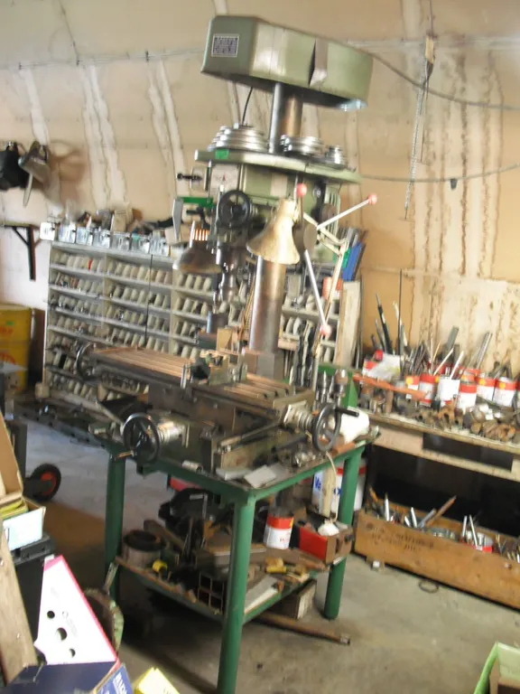 First heavy duty drilling and milling machine w/ work table & contents - table: 35"x28"x32"H