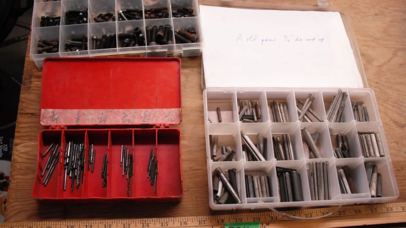 small drill bits, roll pins and cap screws