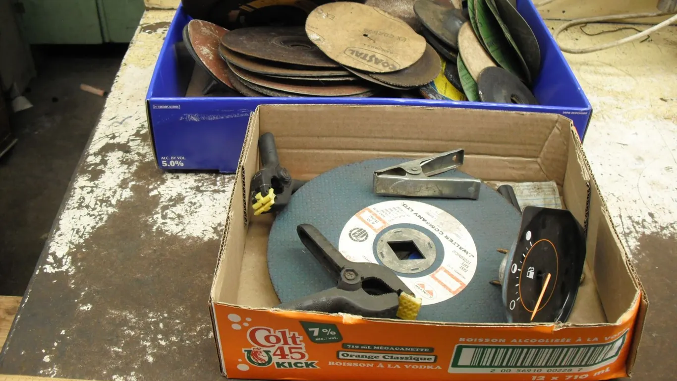 lot of sanding pads, grinding discs, clamps, etc.